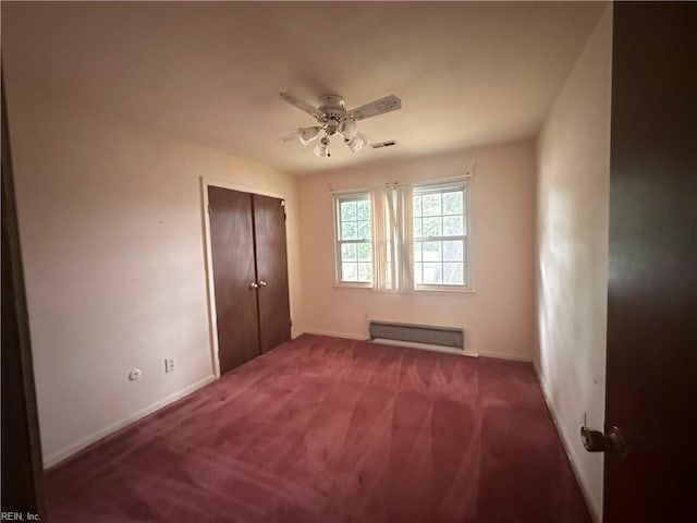 1649 Cardigan St, Chesapeake, VA 23324 - unfurnished bedroom featuring baseboard heating, baseboards, carpet flooring, a closet, and a ceiling fan