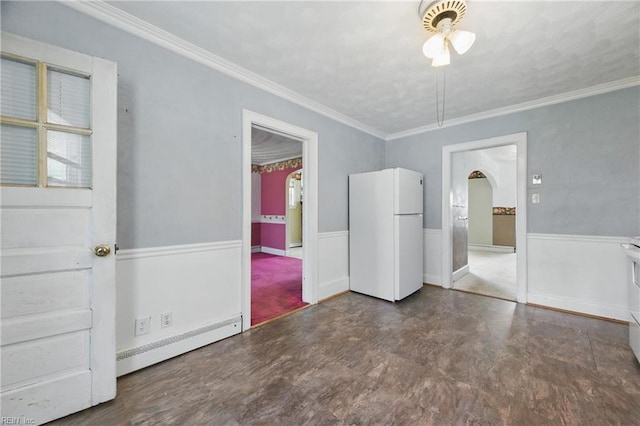 2718 Chesterfield Blvd, Norfolk, VA 23504 - unfurnished dining area featuring a baseboard heating unit, arched walkways, ornamental molding, a wainscoted wall, and a ceiling fan