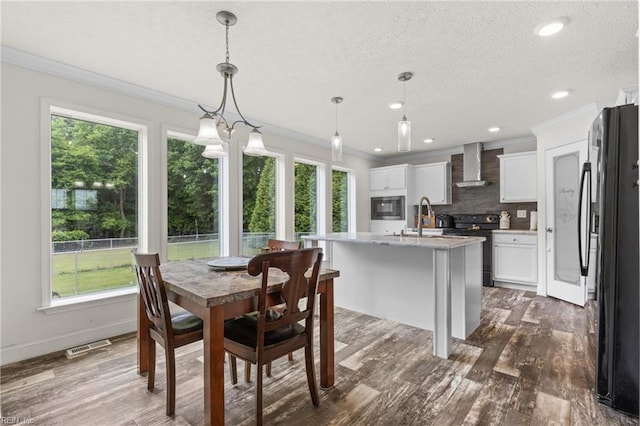 35220 Seacock Chapel Rd, Zuni, VA 23898 - dining area with crown molding, dark wood-style floors, a textured ceiling, recessed lighting, and baseboards