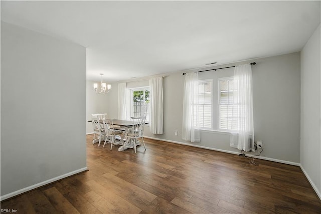 1305 Ettington Ln, Virginia Beach, VA 23464 - dining room with a chandelier, wood finished floors, and baseboards