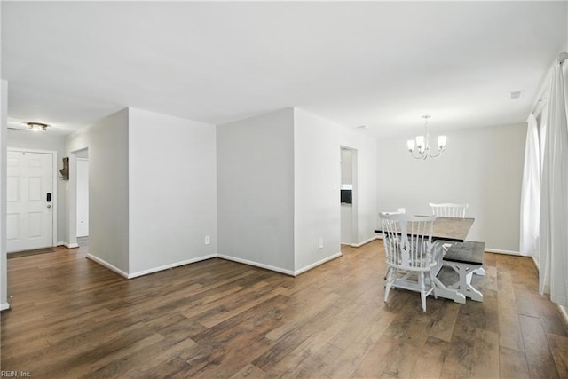 1305 Ettington Ln, Virginia Beach, VA 23464 - dining area with wood finished floors, a chandelier, and baseboards