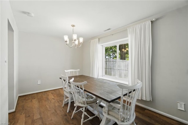 1305 Ettington Ln, Virginia Beach, VA 23464 - dining area featuring a chandelier, wood finished floors, and baseboards