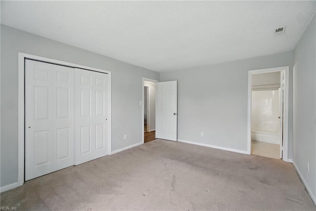1305 Ettington Ln, Virginia Beach, VA 23464 - unfurnished bedroom with carpet, baseboards, a closet, and a textured ceiling