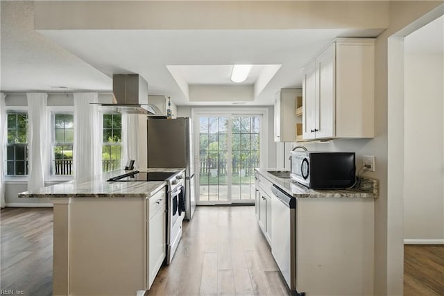 1305 Ettington Ln, Virginia Beach, VA 23464 - kitchen featuring stainless steel appliances, a raised ceiling, light wood-style floors, white cabinets, and light stone countertops