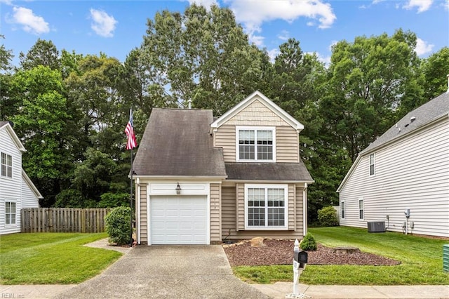 113 Trevor Trce, Yorktown, VA 23692 - view of front of house with driveway, a garage, and view of wooded area