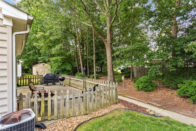 113 Trevor Trce, Yorktown, VA 23692 - view of yard featuring a storage unit and view of wooded area