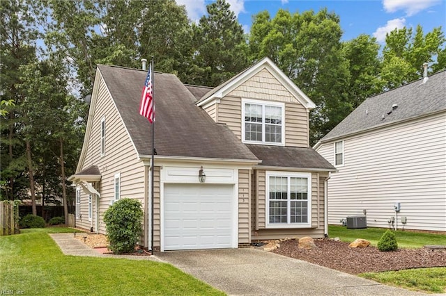 113 Trevor Trce, Yorktown, VA 23692 - view of front facade featuring asphalt driveway, a front lawn, a garage, and roof with shingles