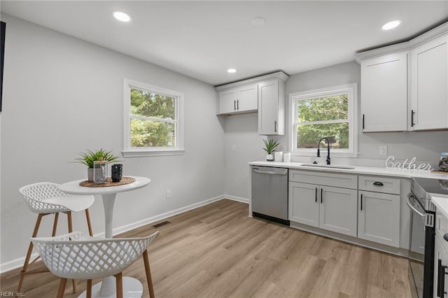 13 Cortez Ct, Hampton, VA 23666 - kitchen featuring stainless steel appliances, a sink, healthy amount of natural light, light wood-style flooring, and recessed lighting