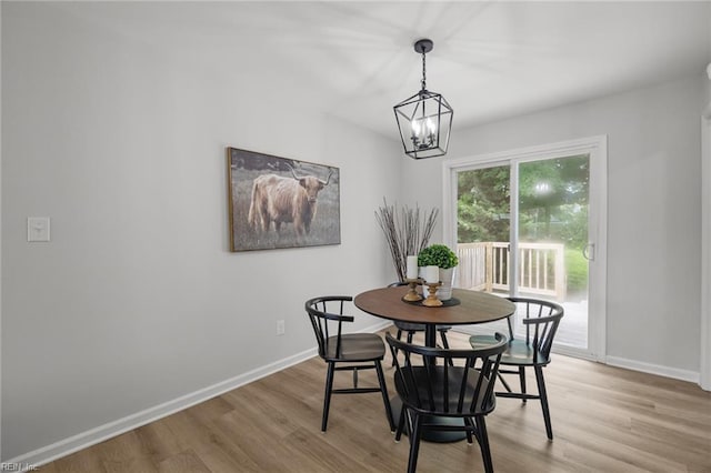 13 Cortez Ct, Hampton, VA 23666 - dining area featuring light wood-style flooring, a chandelier, and baseboards