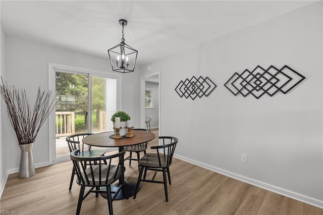 13 Cortez Ct, Hampton, VA 23666 - dining area featuring a chandelier, light wood-style floors, and baseboards