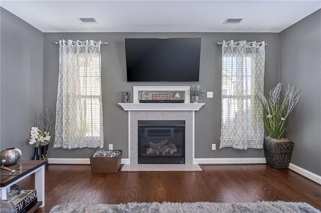 604 Baker Loop, Chesapeake, VA 23320 - living room with wood finished floors, baseboards, and a fireplace with flush hearth