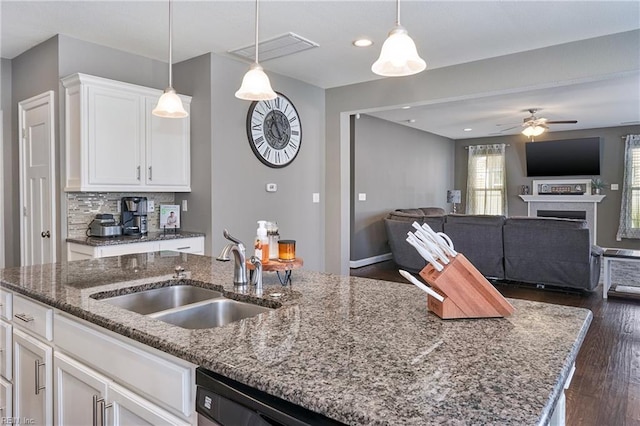 604 Baker Loop, Chesapeake, VA 23320 - kitchen with a sink, a fireplace, open floor plan, white cabinetry, and recessed lighting