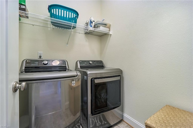 604 Baker Loop, Chesapeake, VA 23320 - laundry area with washer and clothes dryer and baseboards