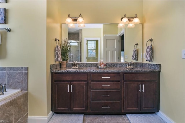604 Baker Loop, Chesapeake, VA 23320 - bathroom featuring baseboards, double vanity, tiled shower, a garden tub, and tile patterned flooring