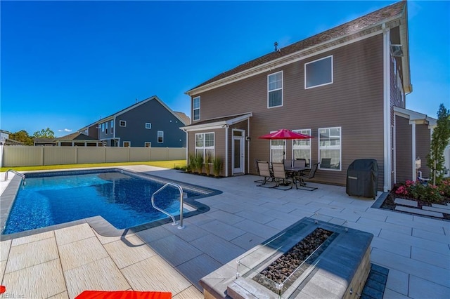 604 Baker Loop, Chesapeake, VA 23320 - view of swimming pool with a fire pit, a patio area, and a fenced backyard