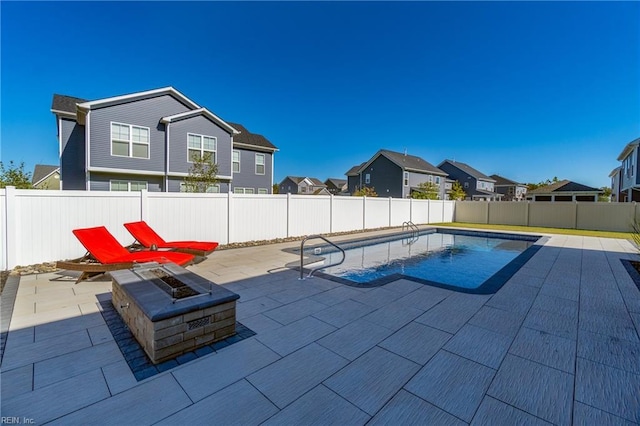 604 Baker Loop, Chesapeake, VA 23320 - view of pool featuring a patio area, a fenced backyard, a fire pit, and a residential view