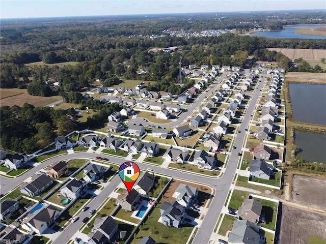 604 Baker Loop, Chesapeake, VA 23320 - aerial view of property and surrounding area featuring a large body of water, nearby suburban area, and a heavily wooded area
