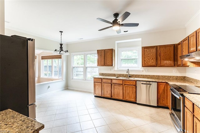 2408 Raynor Ct, Virginia Beach, VA 23456 - kitchen featuring appliances with stainless steel finishes, brown cabinetry, a sink, a chandelier, and crown molding