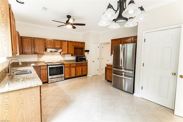 2408 Raynor Ct, Virginia Beach, VA 23456 - kitchen featuring stainless steel appliances, under cabinet range hood, a sink, light stone countertops, and brown cabinetry