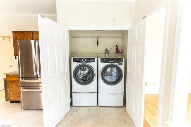 2408 Raynor Ct, Virginia Beach, VA 23456 - washroom featuring separate washer and dryer, light tile patterned floors, and ornamental molding