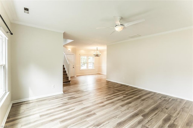 2408 Raynor Ct, Virginia Beach, VA 23456 - spare room with a chandelier, stairs, light wood-style floors, baseboards, and crown molding