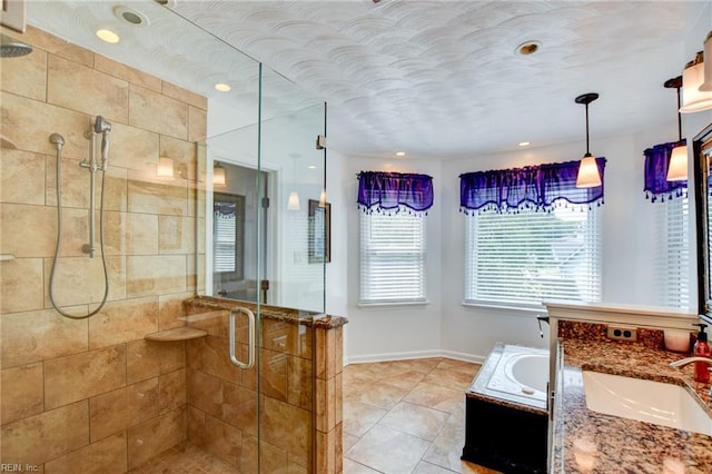 3009 Barberry Ln, Virginia Beach, VA 23453 - full bathroom featuring a stall shower, tile patterned flooring, vanity, baseboards, and a tub to relax in