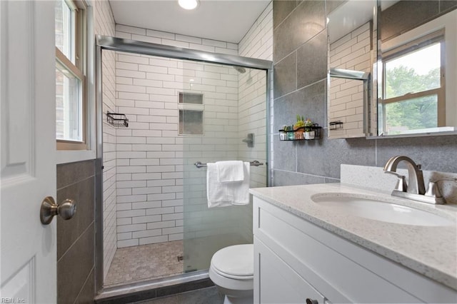 1032 Kincaid Ter, Chesapeake, VA 23320 - bathroom with toilet, vanity, a shower stall, and tile walls