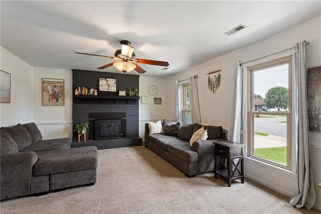 1032 Kincaid Ter, Chesapeake, VA 23320 - carpeted living room featuring a ceiling fan and a brick fireplace