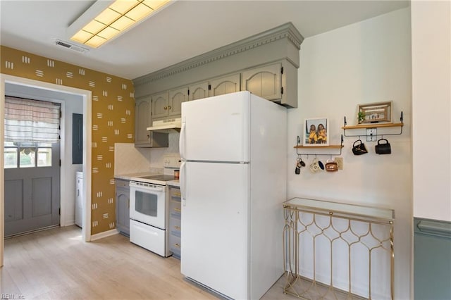 1032 Kincaid Ter, Chesapeake, VA 23320 - kitchen with white appliances, under cabinet range hood, light countertops, light wood-style flooring, and tasteful backsplash