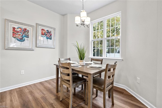 209 Apple Ct, Elizabeth City, NC 27909 - dining room with a chandelier, wood finished floors, and baseboards