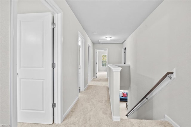 209 Apple Ct, Elizabeth City, NC 27909 - hall featuring an upstairs landing, light colored carpet, baseboards, and attic access