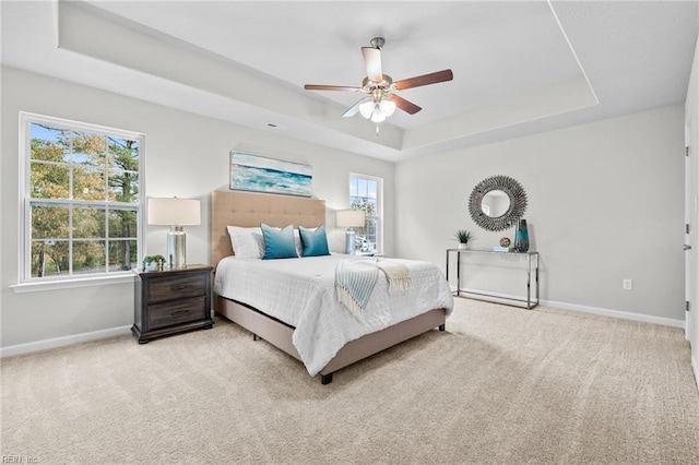 209 Apple Ct, Elizabeth City, NC 27909 - carpeted bedroom featuring a tray ceiling, baseboards, and ceiling fan