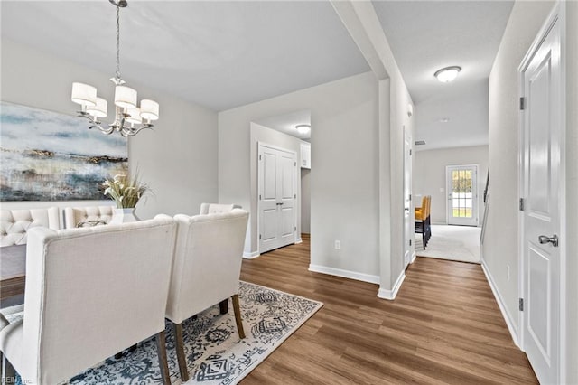 209 Apple Ct, Elizabeth City, NC 27909 - dining space featuring wood finished floors, baseboards, and a chandelier