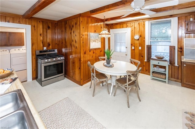 1330 Laurel Cres, Norfolk, VA 23505 - dining area featuring beamed ceiling, a ceiling fan, washer and dryer, wooden walls, and light flooring