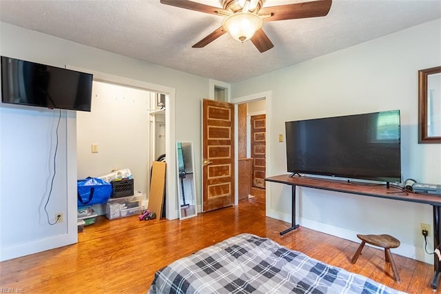 795 Old Oyster Point Rd, Newport News, VA 23602 - bedroom featuring wood finished floors, a textured ceiling, and a ceiling fan