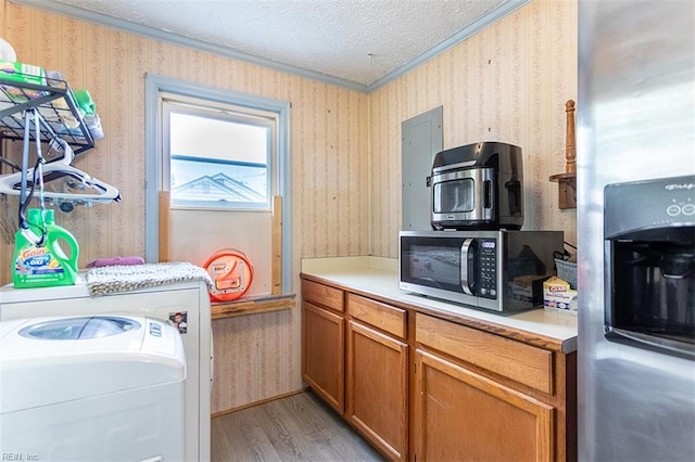 795 Old Oyster Point Rd, Newport News, VA 23602 - laundry area with ornamental molding, light wood-type flooring, a textured ceiling, wallpapered walls, and washer / clothes dryer