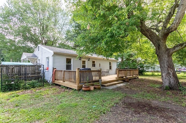 795 Old Oyster Point Rd, Newport News, VA 23602 - back of house featuring a deck and a lawn