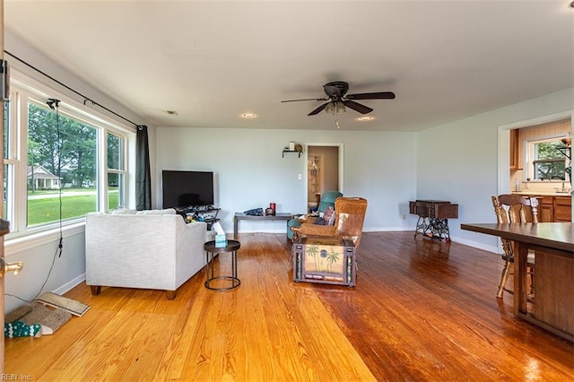 795 Old Oyster Point Rd, Newport News, VA 23602 - living area with wood finished floors and ceiling fan