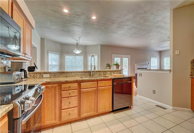 204 Goshawk Ct, Suffolk, VA 23435 - kitchen with black appliances, a sink, light stone countertops, a peninsula, and baseboards