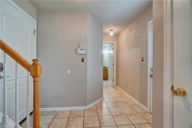 204 Goshawk Ct, Suffolk, VA 23435 - corridor with stairs, light tile patterned floors, and baseboards