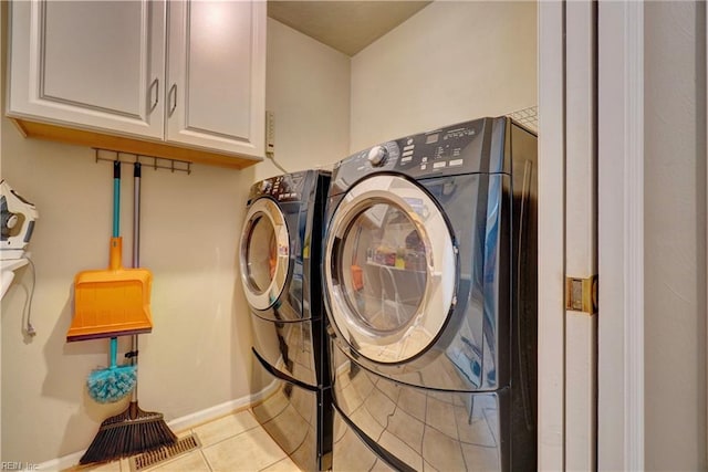 204 Goshawk Ct, Suffolk, VA 23435 - laundry room featuring separate washer and dryer, light tile patterned floors, cabinet space, and baseboards