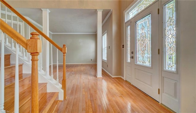 204 Goshawk Ct, Suffolk, VA 23435 - entrance foyer with crown molding, plenty of natural light, light wood-style flooring, baseboards, and stairs