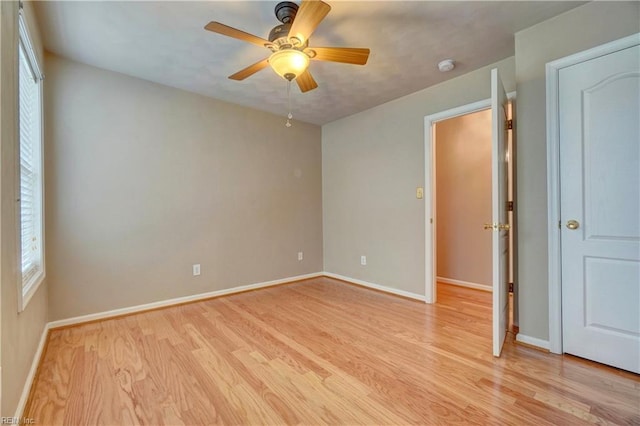 204 Goshawk Ct, Suffolk, VA 23435 - spare room with light wood-style flooring, a ceiling fan, baseboards, and a smoke detector