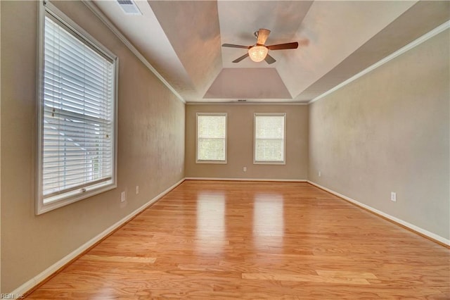 204 Goshawk Ct, Suffolk, VA 23435 - empty room with a ceiling fan, light wood-style flooring, a raised ceiling, baseboards, and crown molding