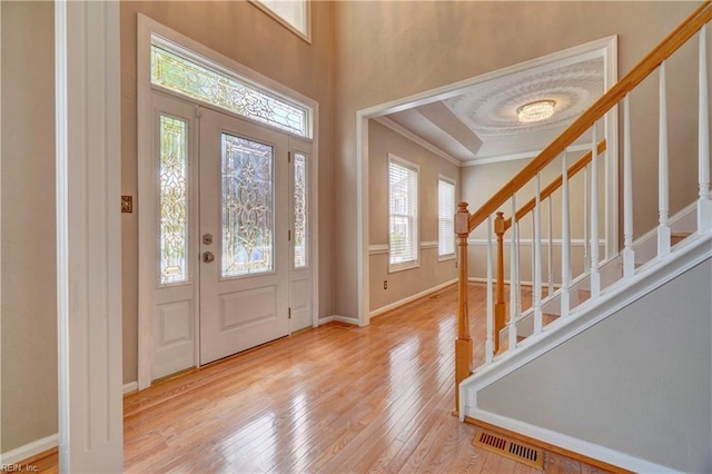 204 Goshawk Ct, Suffolk, VA 23435 - foyer entrance with wood-type flooring, stairs, baseboards, and crown molding
