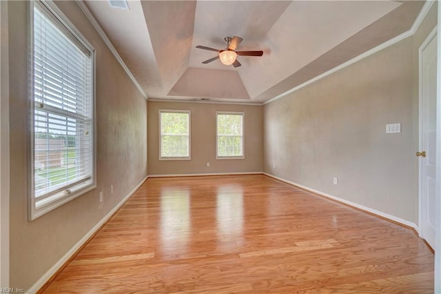 204 Goshawk Ct, Suffolk, VA 23435 - unfurnished room featuring light wood-style floors, ceiling fan, a tray ceiling, baseboards, and crown molding