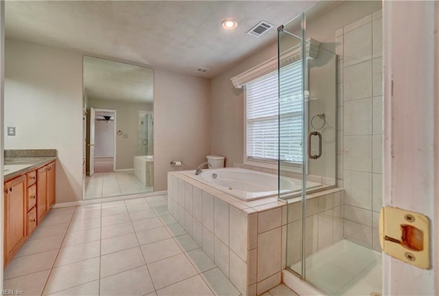 204 Goshawk Ct, Suffolk, VA 23435 - bathroom featuring vanity, a bath, a stall shower, tile patterned floors, and baseboards