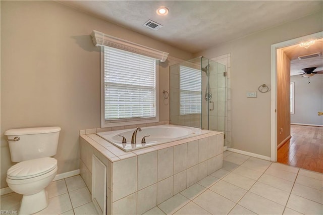204 Goshawk Ct, Suffolk, VA 23435 - bathroom with a bath, tile patterned flooring, baseboards, toilet, and a stall shower