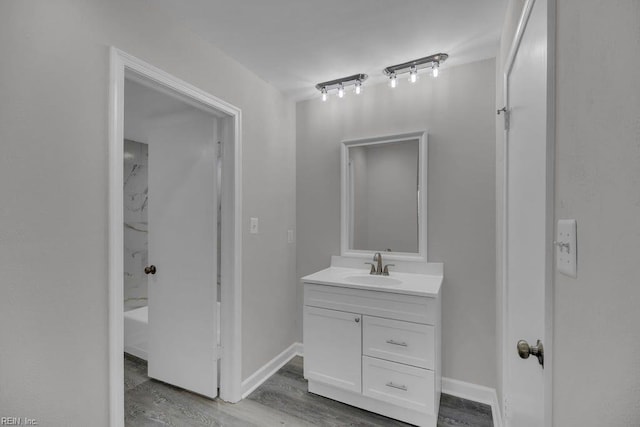 376 Merrimac Trl Unit 113, Williamsburg, VA 23185 - bathroom with vanity, wood finished floors, and baseboards
