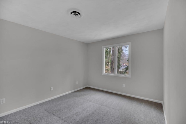 376 Merrimac Trl Unit 113, Williamsburg, VA 23185 - unfurnished room featuring baseboards and carpet flooring
